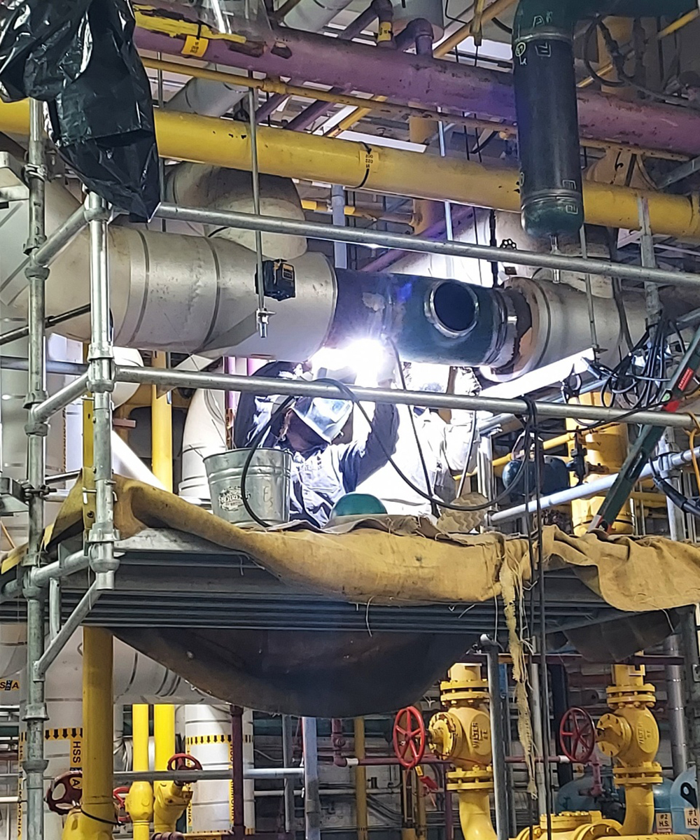 welding a pipe on the ceiling